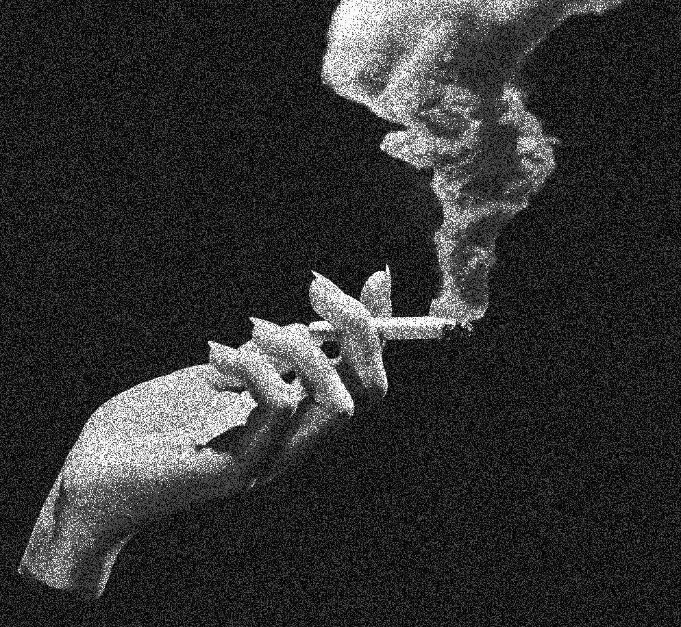 Delicate hands holding a cigarette